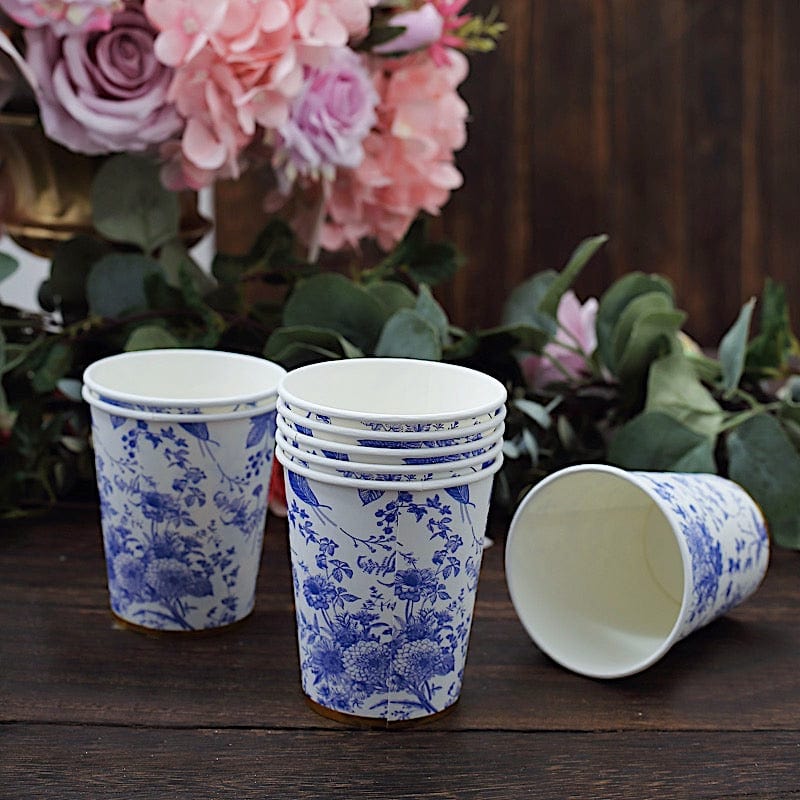 https://balsacircle.com/cdn/shop/files/balsa-circle-cups-24-white-9-oz-blue-floral-design-disposable-paper-drinking-cups-with-gold-rim-dsp-pcup-016-9-blue-32190156046384_800x800.jpg?v=1695370747
