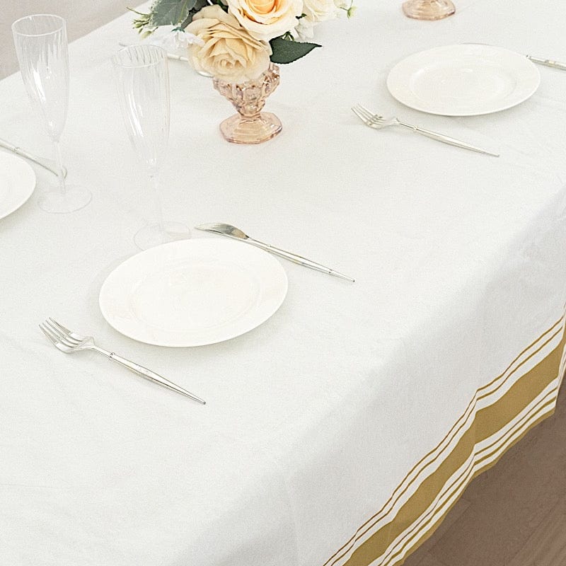 50x108 in White Airlaid Paper Rectangular Tablecloth with Gold Striped Border