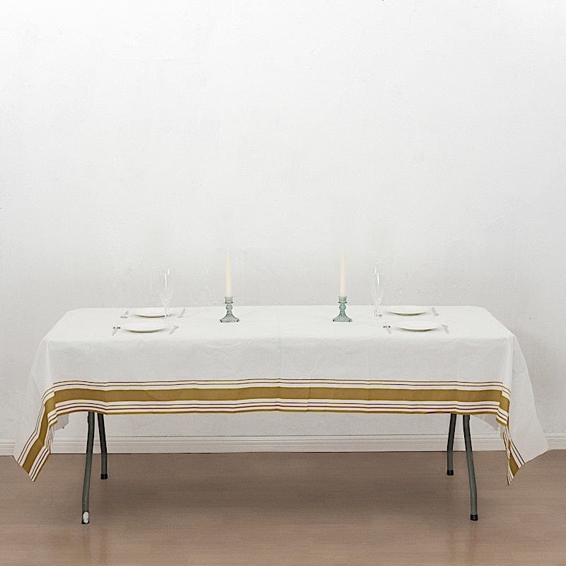 50x108 in White Airlaid Paper Rectangular Tablecloth with Gold Striped Border