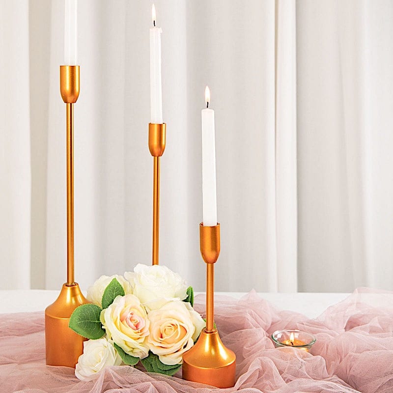 https://balsacircle.com/cdn/shop/products/balsa-circle-candle-holders-3-gold-metal-candlestick-holders-wedding-table-centerpieces-iron-cand-tp010-set-gold-29515542429744_800x800.jpg?v=1647588621