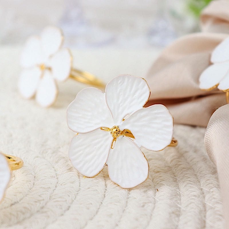 4 Gold Metallic Napkin Rings with White Flower Design